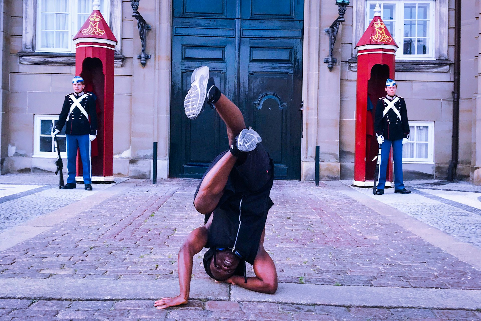 man doing stunt near white and blue castle